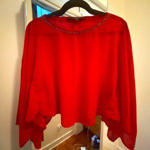 GUESS: burnt orange cape blouse